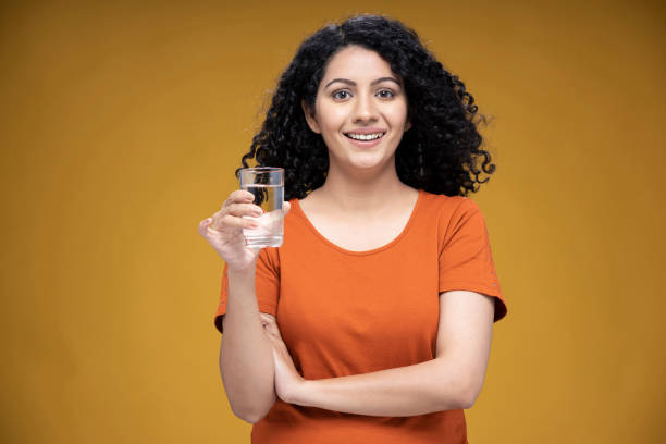 istockphoto-1310539819-612×612 Water, Women, One Woman Only, Drinking, Adult, adult only, India, Indian ethnicity,